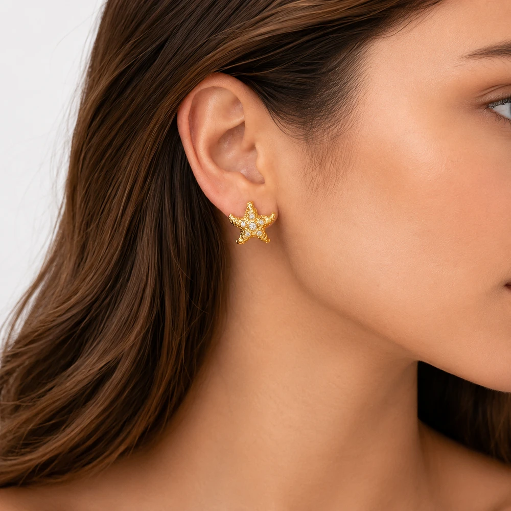 Gold starfish earring